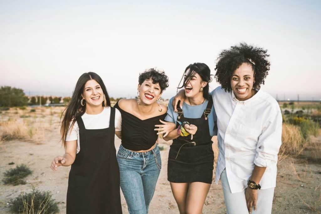 Smiling women posing in countryside